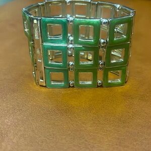 cuff bracelet with green anodized aluminum squares and silver tone